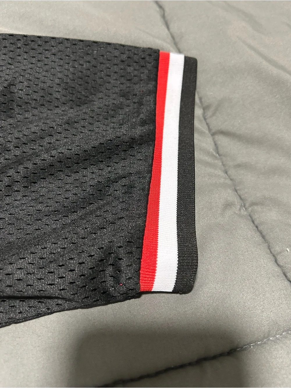 Million Dolla Motive Black & Red Mesh Sports Jersey. Size Medium